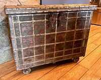 Full view of front of trunk showing size, grid design, wheels