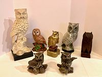 Group shot of all seven owl items
