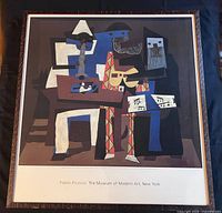 Full view of framed poster under glass