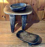 Tall stool with bowl placed on top, low stool in foreground