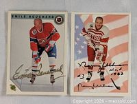 Both autographed cards side by side