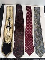 Four silk neckties laid out side by side