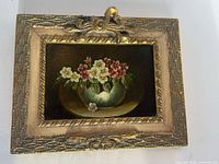 Front view of painting within giltwood frame