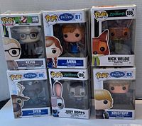 Front view of all six boxed Funko Pop figures