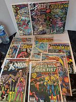 Group shot of all ten bagged comics fanned out