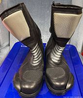 Front view of both boots showing shin and instep textile panels
