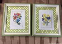 Both framed floral prints side by side
