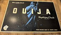 Box lid showing William Fuld Ouija branding and graphics