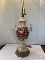 Full view of porcelain floral table lamp with cord and socket