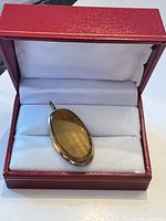 Pendant in display box showing front view