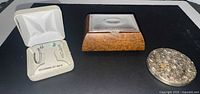 Group shot of earring set, jewelry box and compact mirror