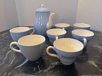 Full set showing teapot, 4 tea cups, 3 coffee cups