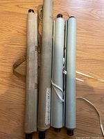 Four rolled hanging scrolls with fabric mountings and wood dowels