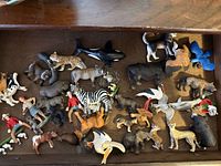 Drawer containing entire assortment of animal and human Schleich figures
