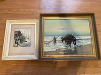 Both framed paintings together for scale and comparison