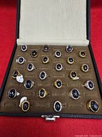 Open display case showing rows of rings