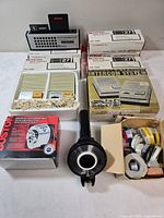 All boxed vintage office accessories displayed together