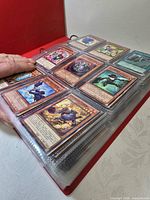 binder page showing nine Yu-Gi-Oh! monster cards