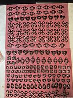 Full view of two display pads filled with assorted gunmetal findings