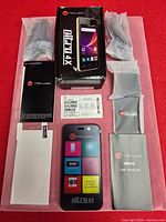 Entire lot laid out with phone, box, accessories, manuals