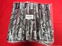 Front view of sealed pack showing ten Golf Pride MCC Plus4 Align grips