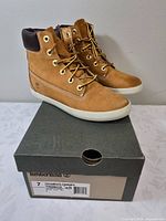 Side view of both boots on box