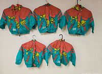 Five matching Asics Austria Ski Team kids jackets displayed