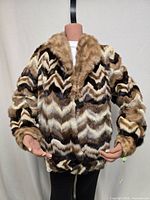 Front view of mink fur jacket on mannequin