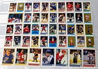 wide view of about 40 assorted 1989 OPC hockey stickers laid out in grid