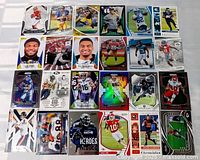 All 24 football cards laid out, showing fronts