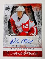Front of Upper Deck Artifacts AutoFacts card showing Niklas Kronwall image and blue ink autograph