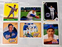 Six Nolan Ryan baseball cards laid out