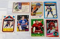 Front view of six vintage hockey cards laid out in two rows