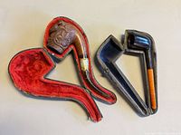 Both pipes shown in open cases