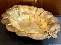 Top angled view showing scalloped rim, hammered finish, floral rim accent