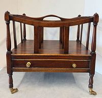 Front view showing compartments, drawer and brass knobs