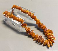Full view of necklace on display to show overall length and bead style