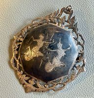 Front view showing niello panel and border