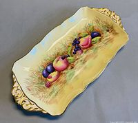 Full view of rectangular Orchard Gold tray showing fruit motif and handles