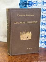 Front cover showing title and gilt vignette