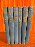Full set of six Cassell's Household Guide volumes standing upright showing spines