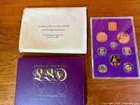 Full lot showing envelope, presentation folder, sealed coin case