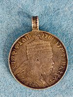 Obverse showing Emperor Menelik II bust and attached bale