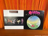 Both Heart albums Bad Animals and Magazine front covers side by side