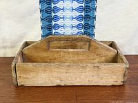 Front view of wooden cutlery tray