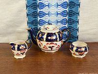 Front view of complete three-piece Imari tea set