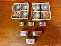 Full set of 17 napkin rings arranged on table