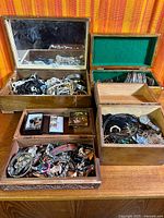 Overall lot with four open wooden boxes filled with assorted jewelry