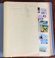 Album open showing cover page with handwritten count and stamps in side pocket