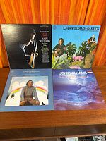 All four John Williams vinyl albums laid out on table